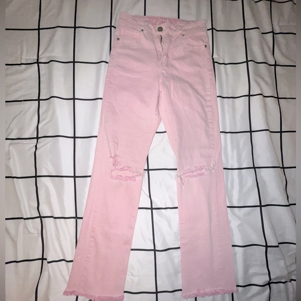 Pink flared ripped jeans